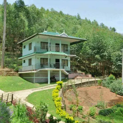 a house on top of a hill with a garden at Sahari Villa, Vattavada in Vattavada