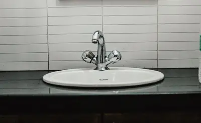 a sink with a faucet on top of a counter at Sahari Villa, Vattavada in Vattavada