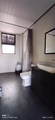 a bathroom with a toilet and a tub and a sink at Ranches & Kennels 2BR Coorg in Kushālnagar