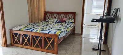 a bedroom with a bed and a camera at La casona in Kottayam