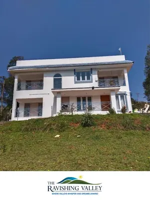 a white house on top of a hill at Ravishing Valley in Ketti