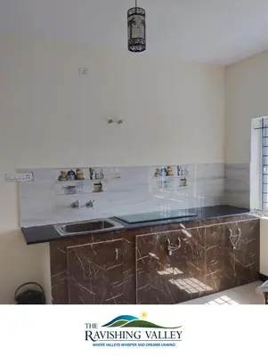 a kitchen with a sink and a counter top at Ravishing Valley in Ketti