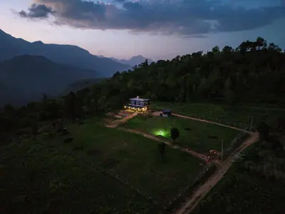 an aerial view of a house in a field at Casablanca Resort in Kanthalloor