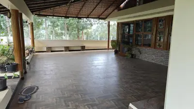an empty lobby of a building with a tile floor at Eagles Nest in Dimbam