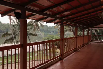 a view from the balcony of a resort at Kaayal Experience - Entire Home in Kozhikode in Kozhikode