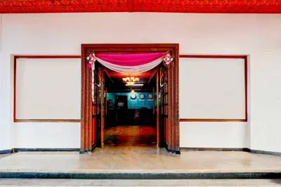 a room with two doors with a pink curtain at Collection O Puthali Park Near Mysuru Railway Station in Mysore