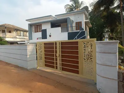 a house with a gate and a fence at La casona in Kottayam