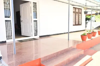 a view of the front porch of a house at Classic Homestay Hills Ooty in Ooty