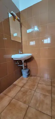 a bathroom with a sink and a mirror at Classic Homestay Hills Ooty in Ooty