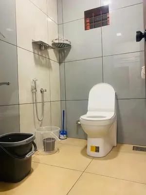 a bathroom with a toilet and a shower at Joevilla-1BHK Near Kottiyoor in Kelakam