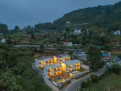 an aerial view of a house on a hill at The Hosteller Kodaikanal in Kodaikānāl