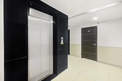 a walk in closet with black and white walls at Townhouse Oak Mysuru Railway Museum in Mysore