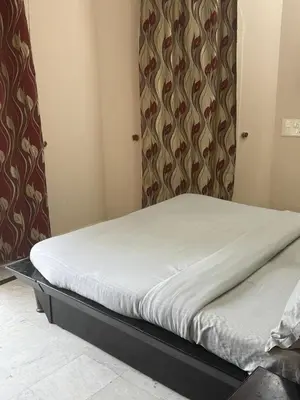 a small bed in a small room with at City home-SGH in Mysore