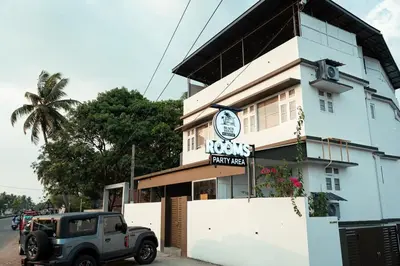 a jeep parked in front of a building at Beach House in Kozhikode