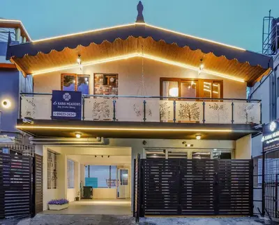 a facade of a house with a balcony at Le Karaj Meadows in Lovedale