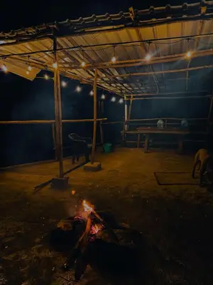 a large room with a fire in the middle of it at Muffintrip stays camp N trek in Kūkkāl