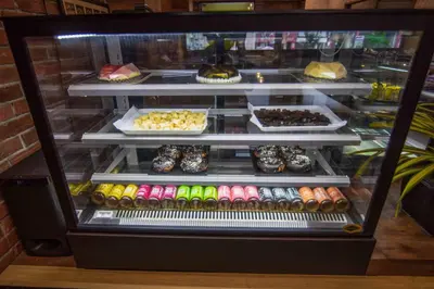 a refrigerator filled with lots of different types of food at Kohinoor Hotels in Erode