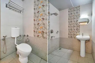 a bathroom with a toilet and a sink at Hotel O Kushal Nagar Near KSRTC Bus Stand in Kushālnagar