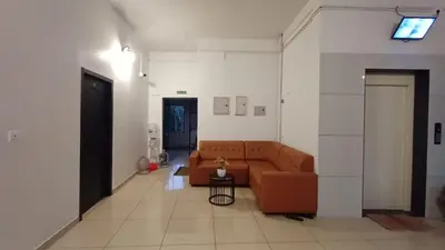 a living room with a couch and a table at SAF RESIDENCY mukkam in Mukkam