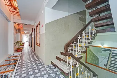 a hallway of a house with a staircase at Collection O Erode VOC Park in Erode