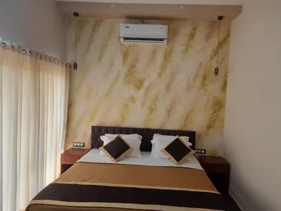a bedroom with a bed with two pillows at Vipinam, The riverside retreat in Kotamangalam