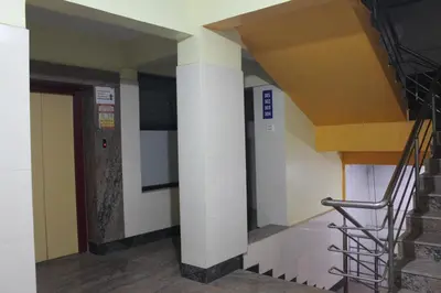 a staircase in a building with a stair case at Aishvarya Residency in Coimbatore