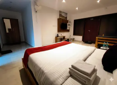 a bedroom with a large white bed in a room at Forest Soul by BOB Hotels - Forest Retreat with Pool in Batheri