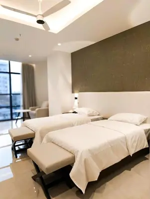 a row of beds in a room at The Palazzo Chakolas in Trichūr