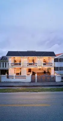 a large white building with a street in front of it at King Palace Ooty by VOYE HOMES in Ooty