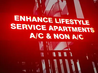 a sign that readsencelicservice appliances ag and nonagent at Enhance Lifestyle Service Apartments in Thamarassery