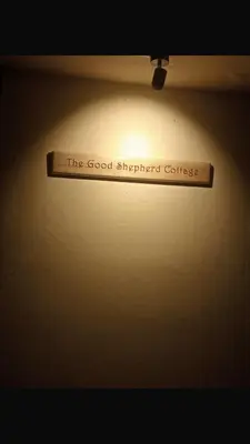 a sign that reads the good shepherd course hanging from a ceiling at GSC Family Holiday Home in Pollāchi