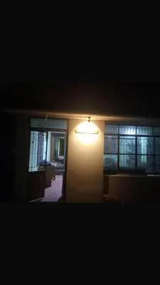 a light on the side of a room with a hallway at GSC Family Cottage in Samattūr
