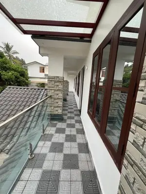 a hallway of a house with a roof at Aroha Residence - Sleek and Spacious Wayanad Villa in Kalpetta