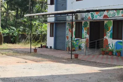 a house with a painting on the side of it at bohom STAYORA in Nedumbassery