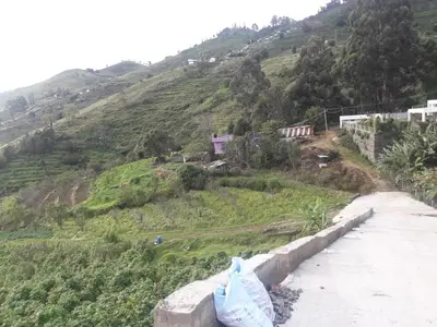 a view of a hill with a road and a mountain at Zirku Garden Kodaikanal in Kodaikānāl