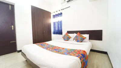 a bedroom with two beds in a room at Honey Residency Codissia stay in Coimbatore