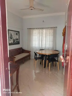 a living room with a couch and a table at Sumukh's house in Mysore