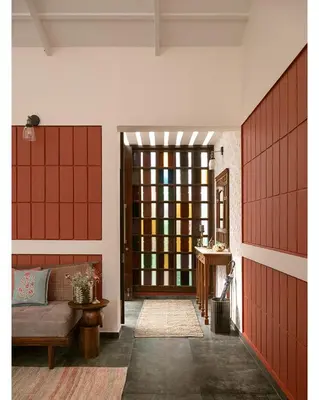 a room with a door with a couch and a table at Hillside Home 3 BHK Villa by tisyastays in Yedapalli