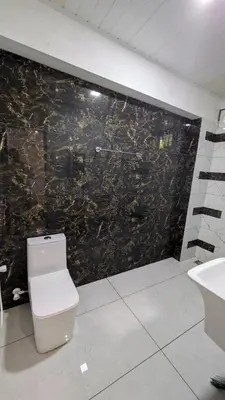 a bathroom with a toilet and a sink at village stay Chittur Thathamangalam in Tattamangalam