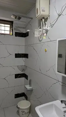 a bathroom with a toilet and a sink at village stay Chittur Thathamangalam in Tattamangalam
