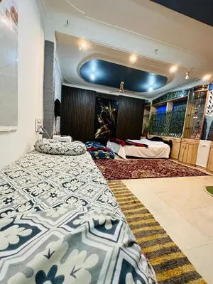 a bedroom with two beds in a room at Mysore City Vibe By A1k in Mysore