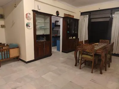 a living room with a table and a dining room at 3 BHK Flat for rent at Mysuru in Mysore