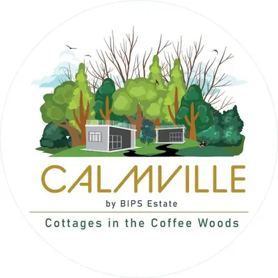 a logo for calamineville by bikes estate offices in the coffee woods at Calm Ville in Ponnampet