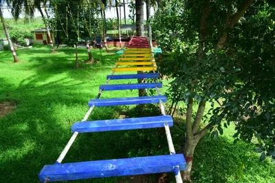 a row of blue steps in a park at Lucky Escape Adda in Hullahalli