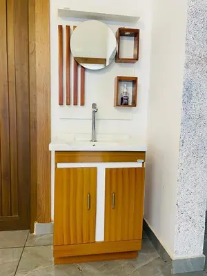 a bathroom with a sink and a mirror at The Soul 1 Service Villa in Mananthavady