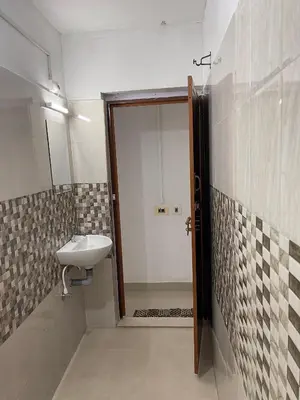 a bathroom with a sink and a mirror at Wayanad Midnight Farmhouse in Sultan Bathery