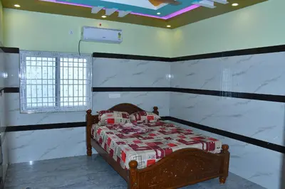 a bedroom with a bed in a room at CS RESORT River point in Wodapatti