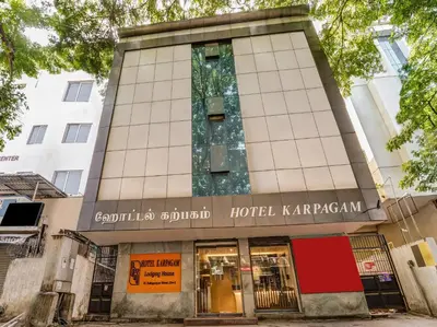 a hotel karavanagh building on a street at Hotel Karpagam Lodging House Nr Railway Station & Gandhipuram bus stand in Coimbatore