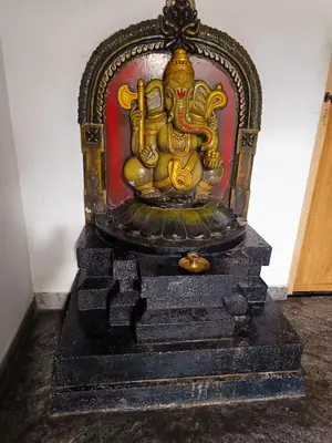 a statue of an elephant sitting on top of steps at Poonthanam guest house in Guruvāyūr