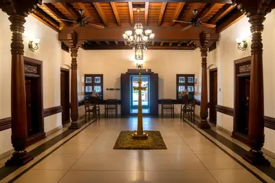a hallway with a cross in the middle of a building at Villa de 1945 in Mahe